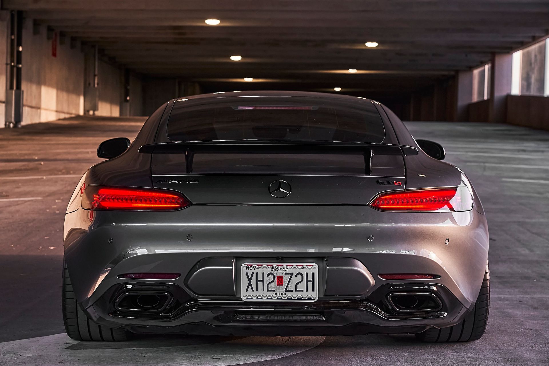 A mercedes benz gt is parked in a parking garage