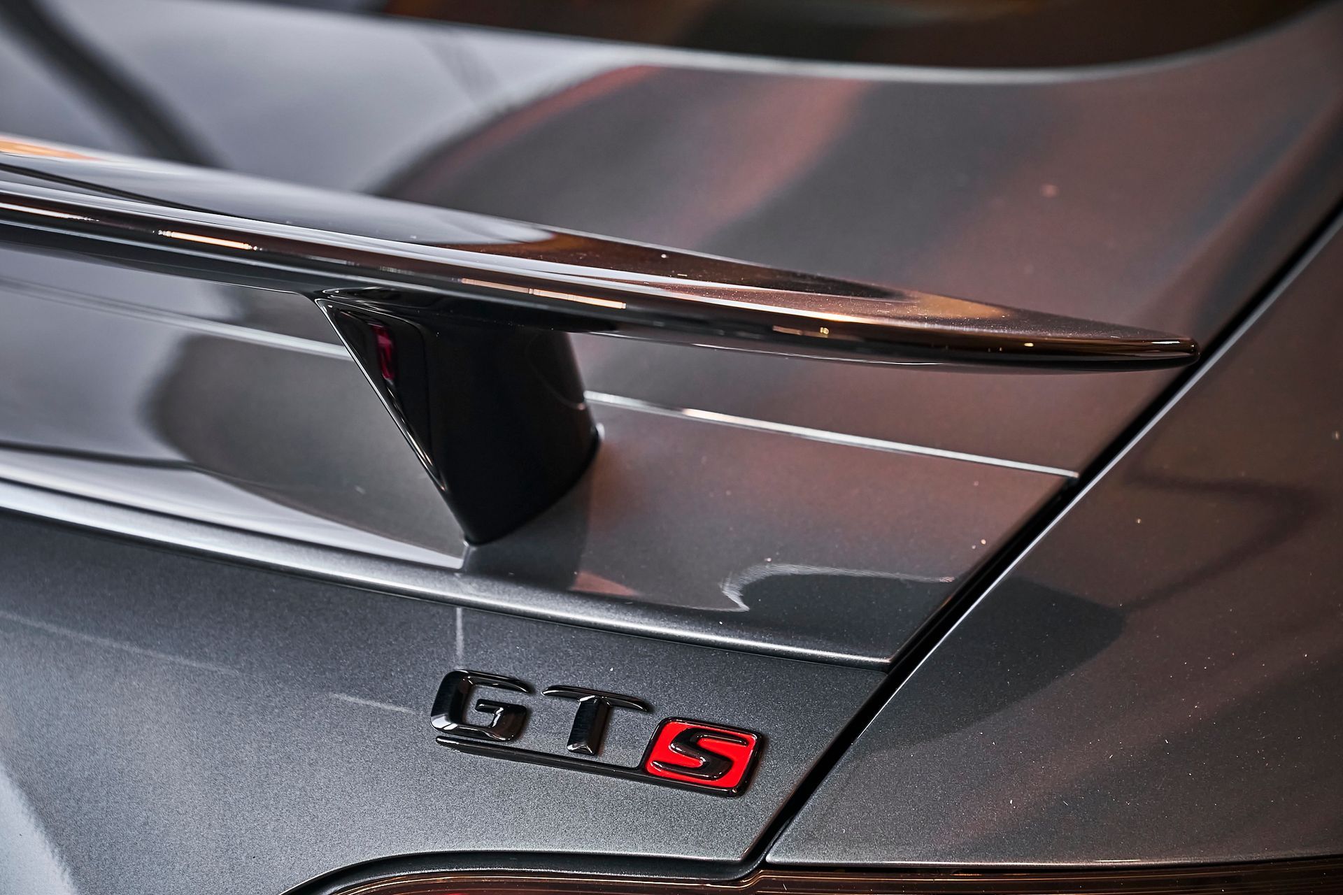 A close up of the rear end of a gts car