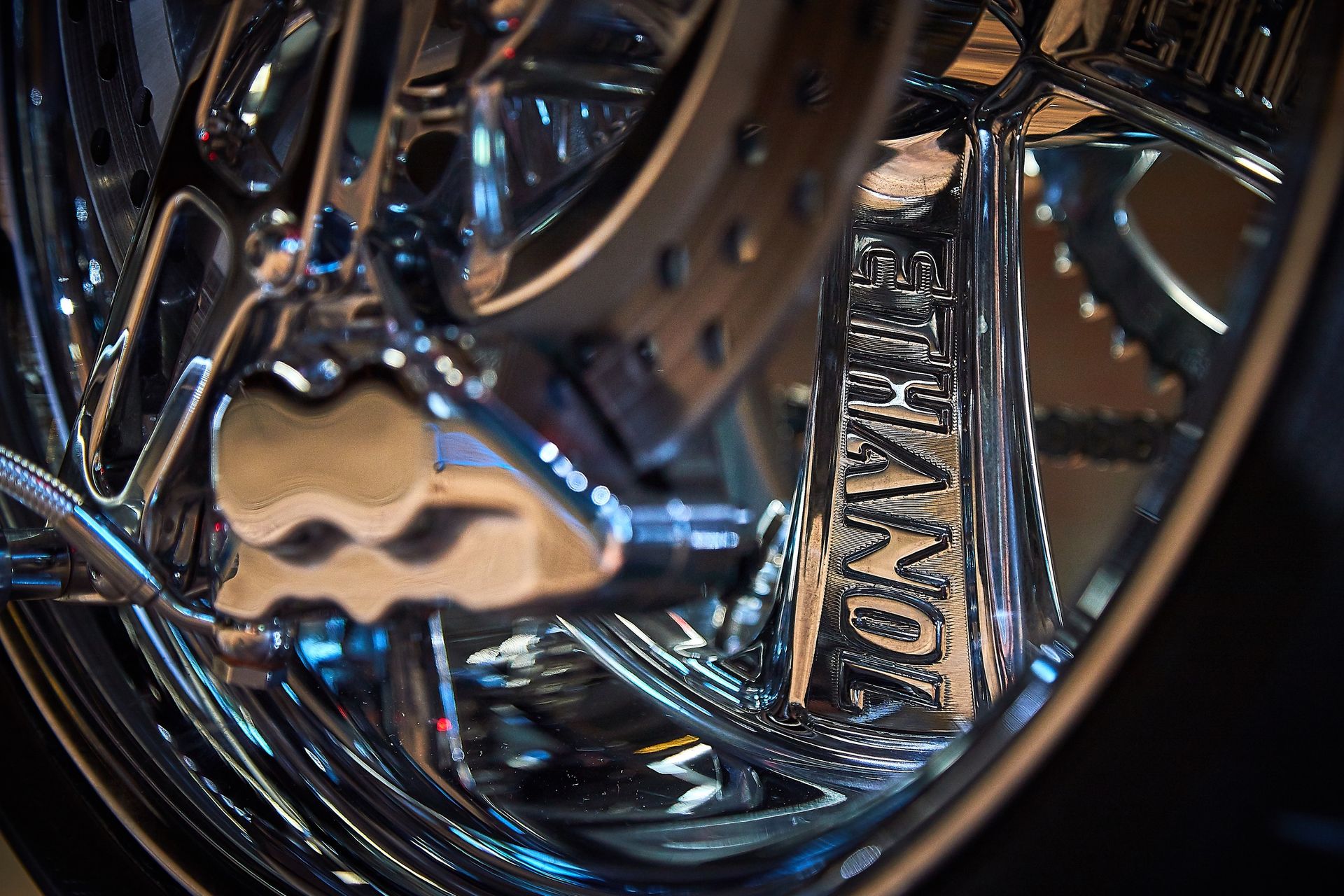 A close up of a motorcycle wheel with the word mongoose on it