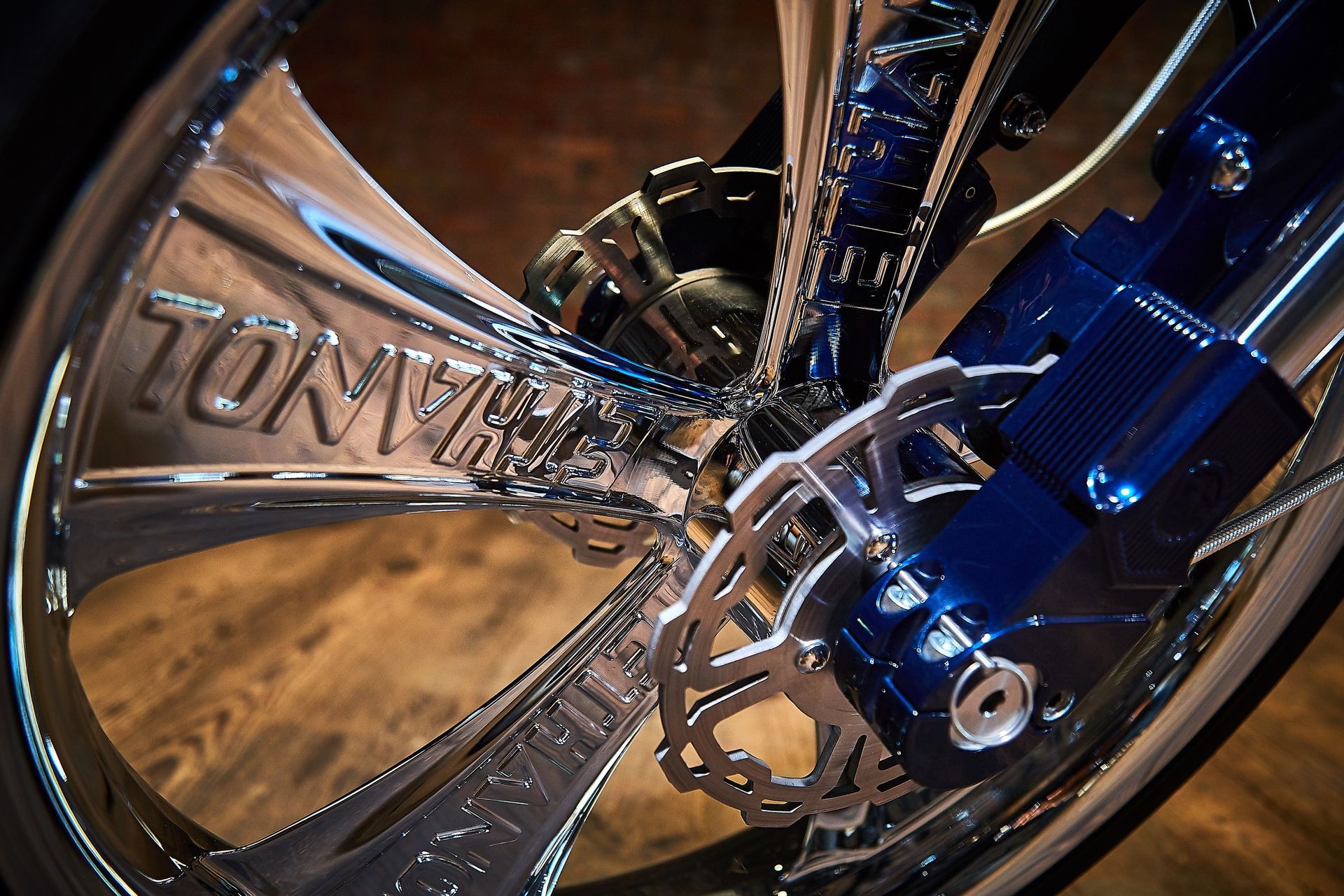 A close up of a motorcycle wheel with the word tony on it