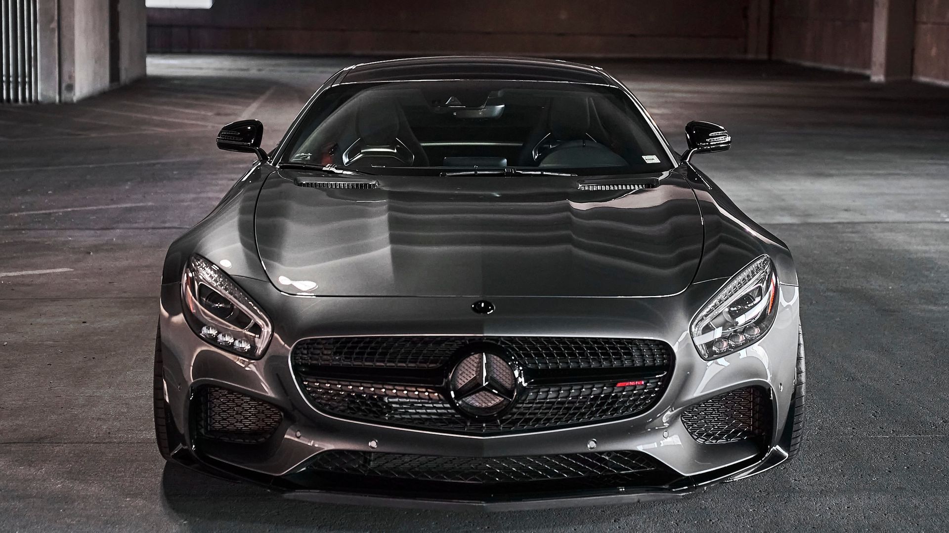 A mercedes benz gt is parked in a parking garage.