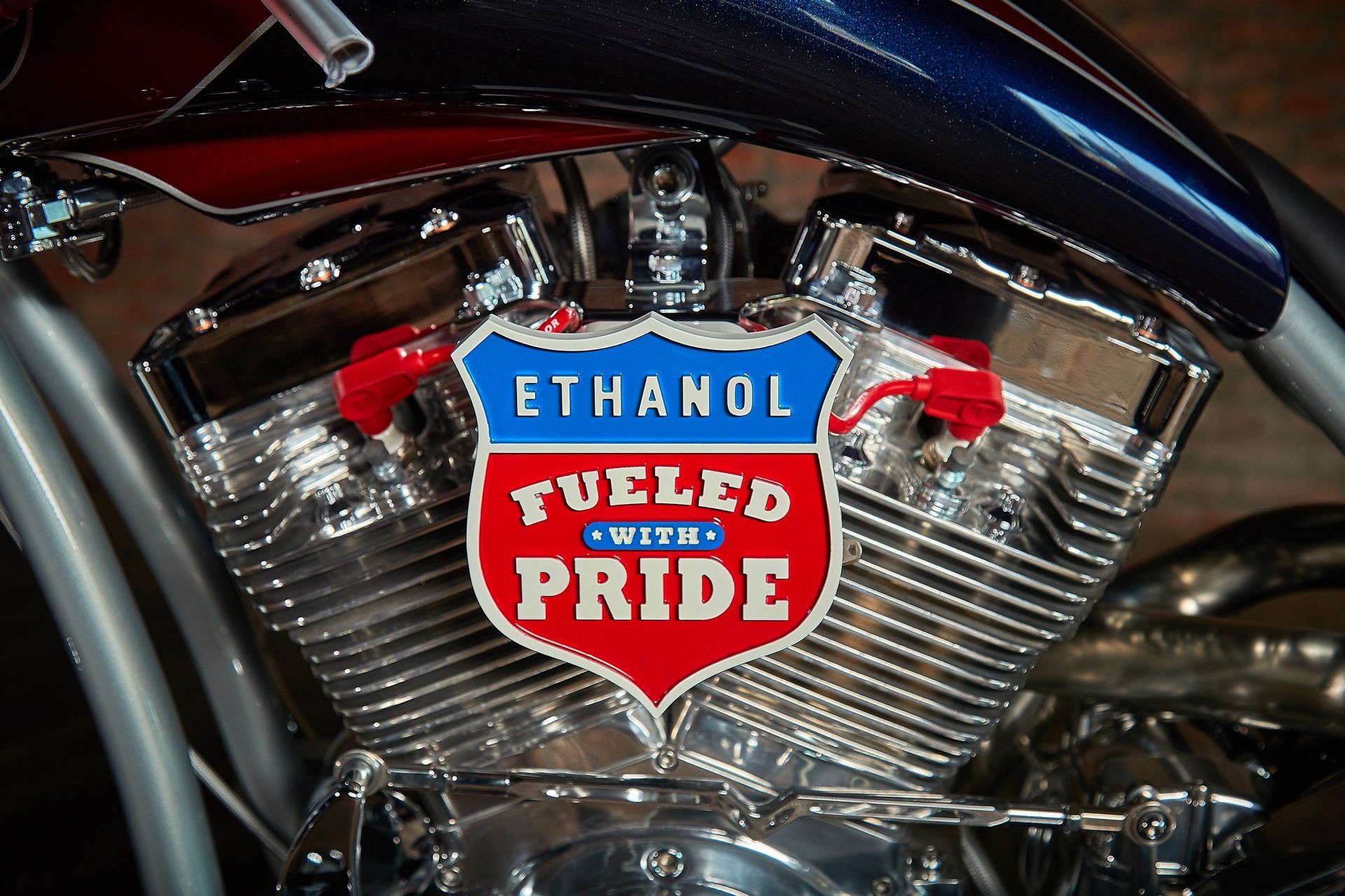A close up of a motorcycle engine that says ethanol fueled with pride