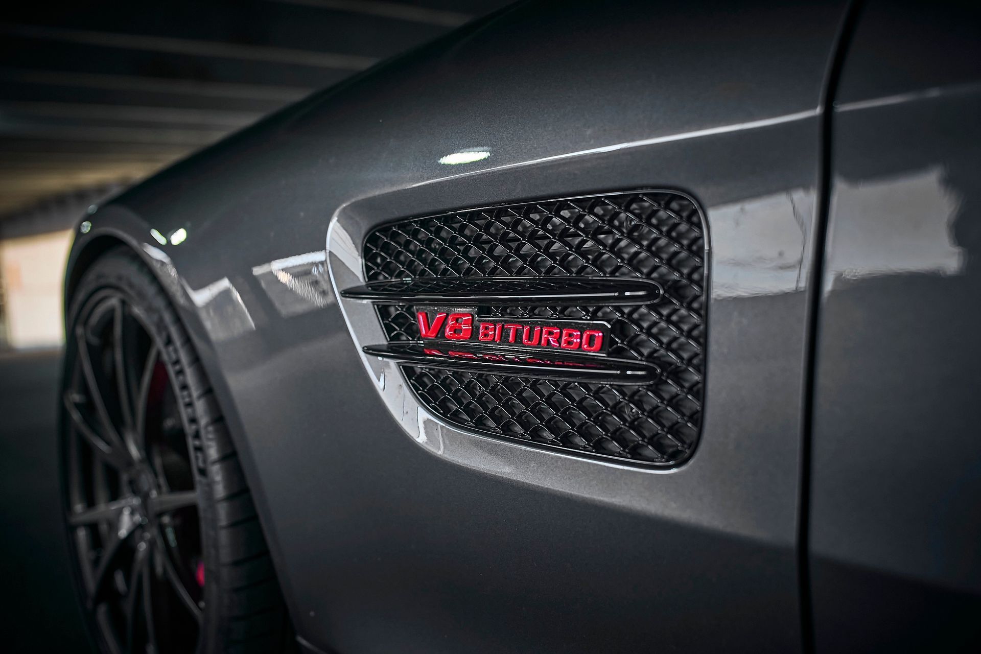 A close up of the side of a mercedes benz amg gt 63 s.