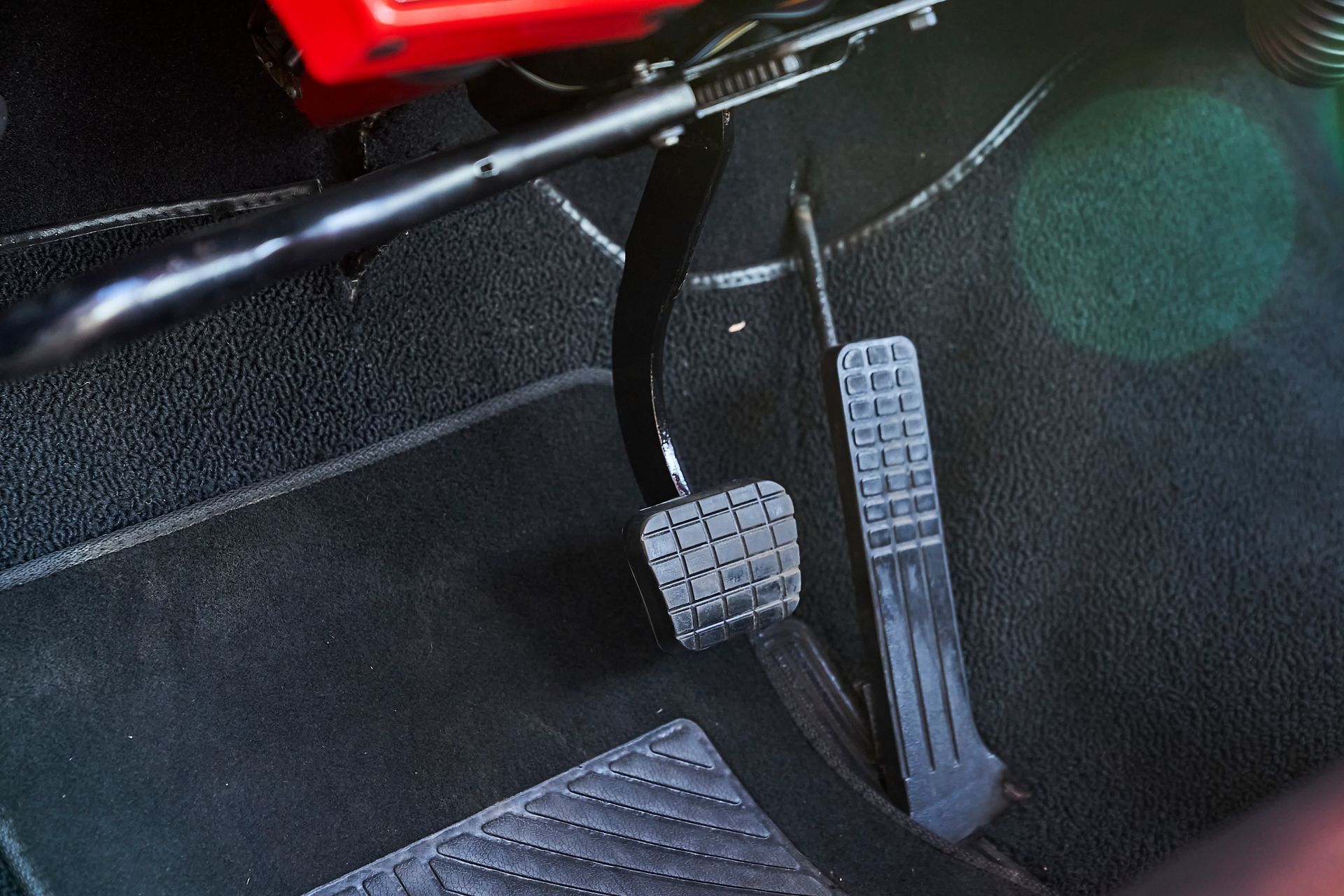 A close up of a brake pedal in a car