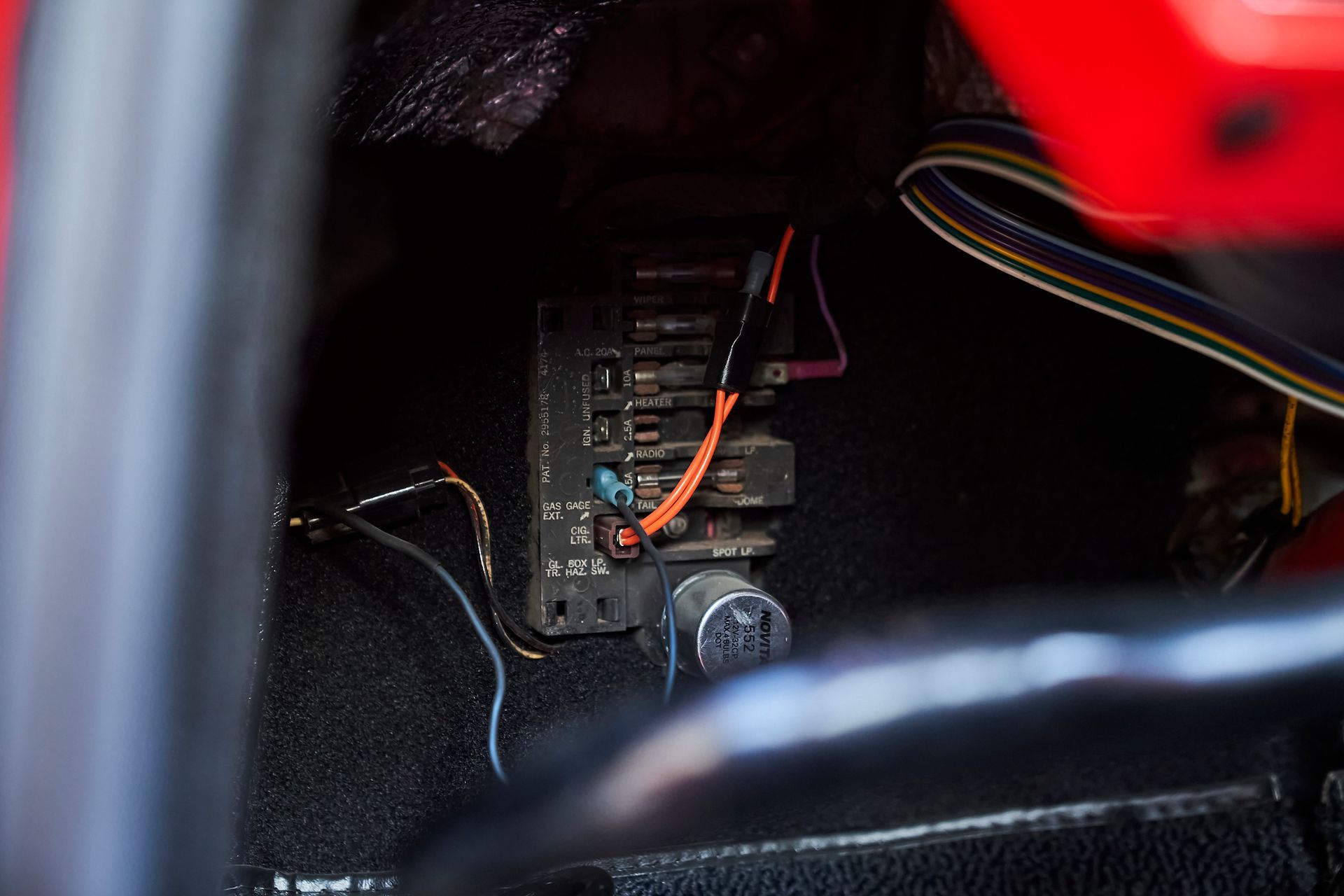 A close up of a fuse box in a car
