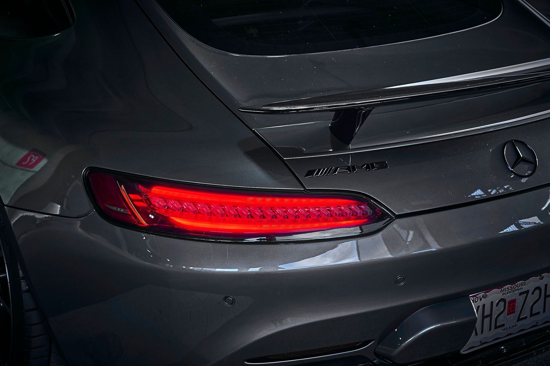 A close up of the tail light of a mercedes amg gt s.