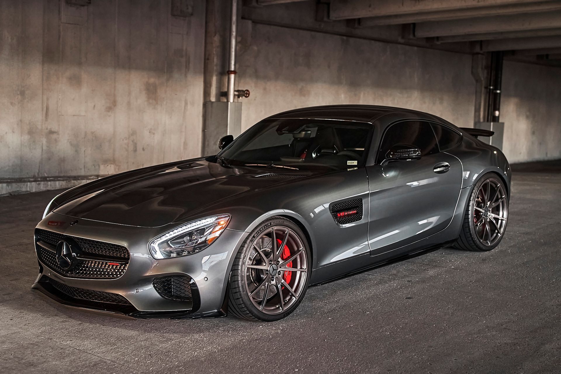 A mercedes benz gt is parked in a parking garage.