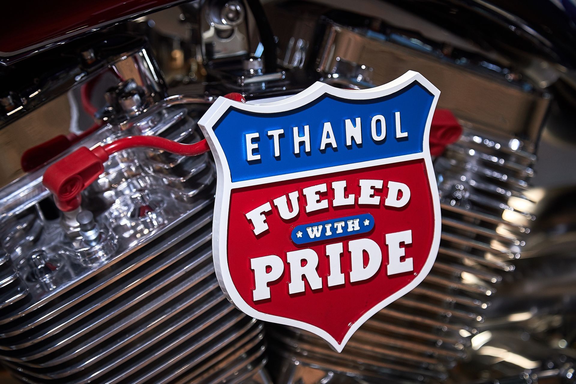 A motorcycle engine with a sticker that says ethanol fueled with pride