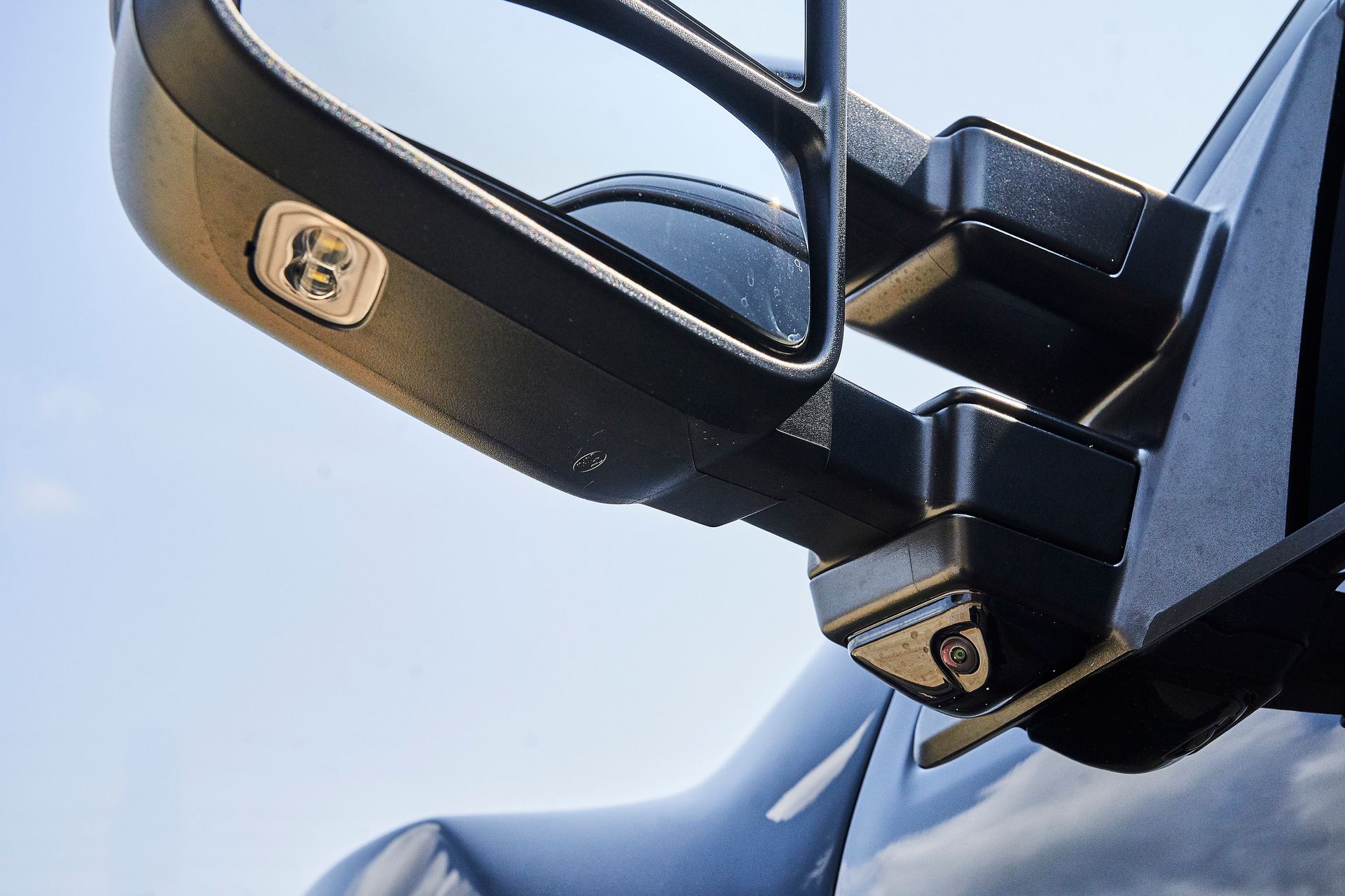 A close up of a side view mirror on a car