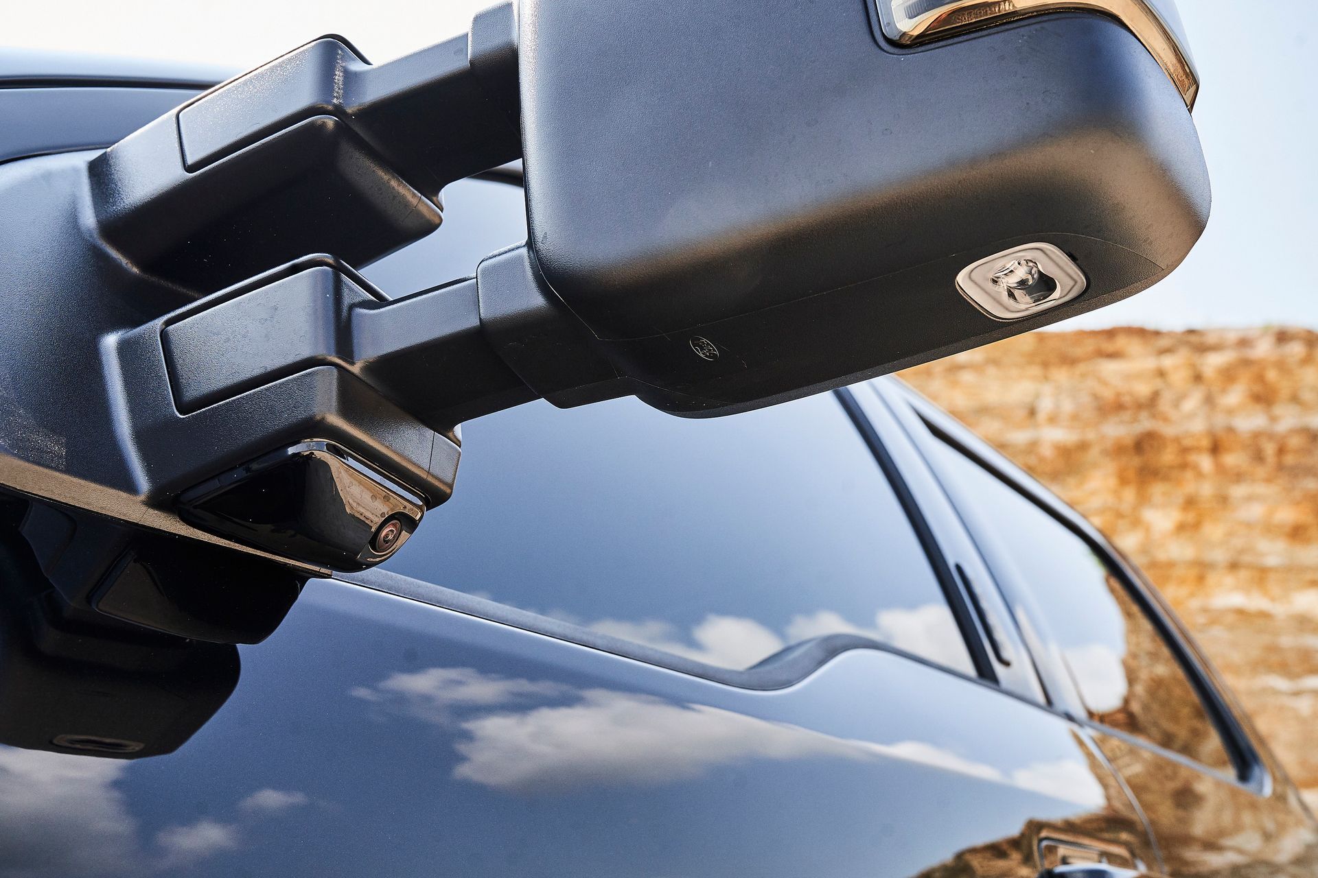 A close up of a side view mirror on a car