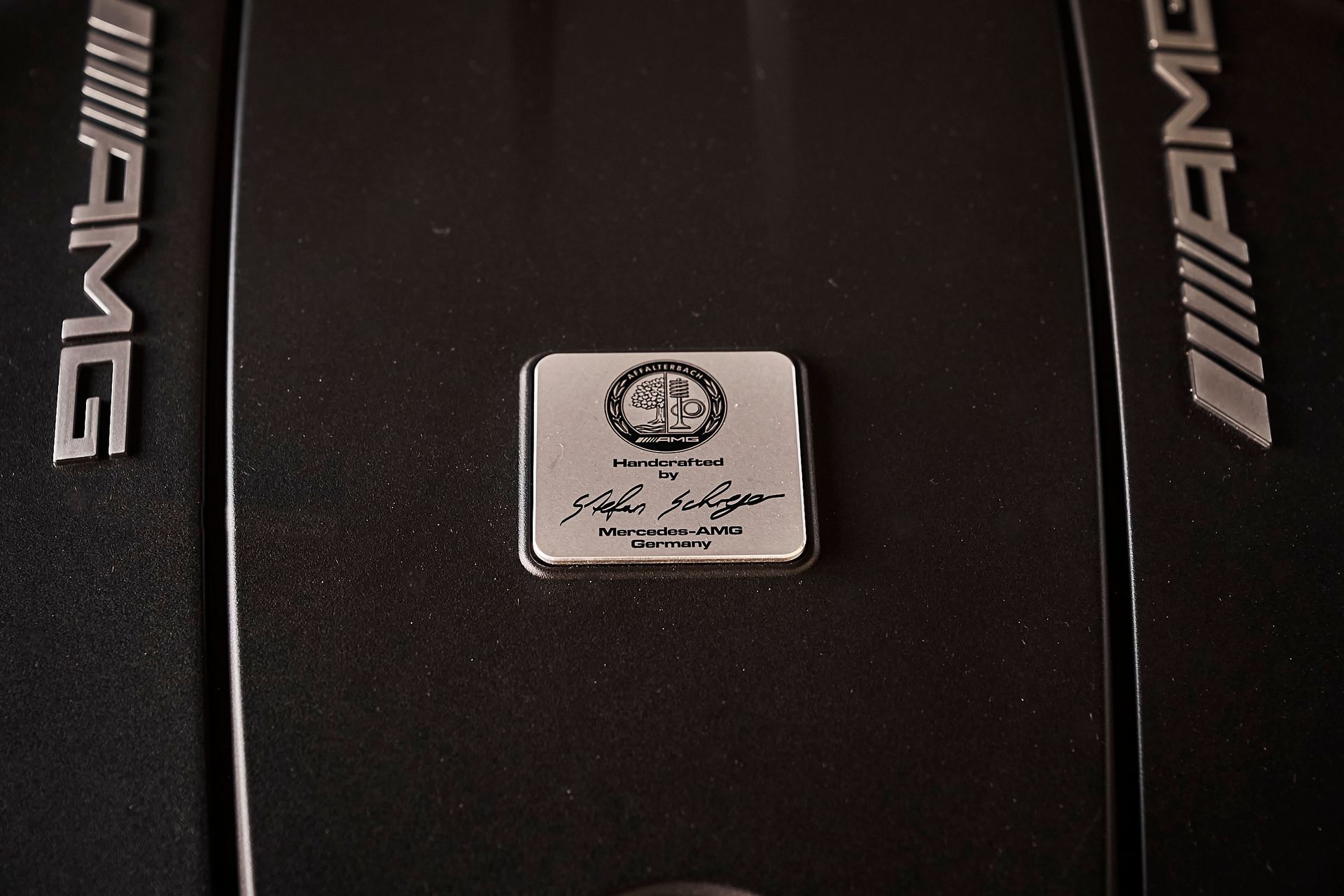 A close up of a car engine with the word amg on it
