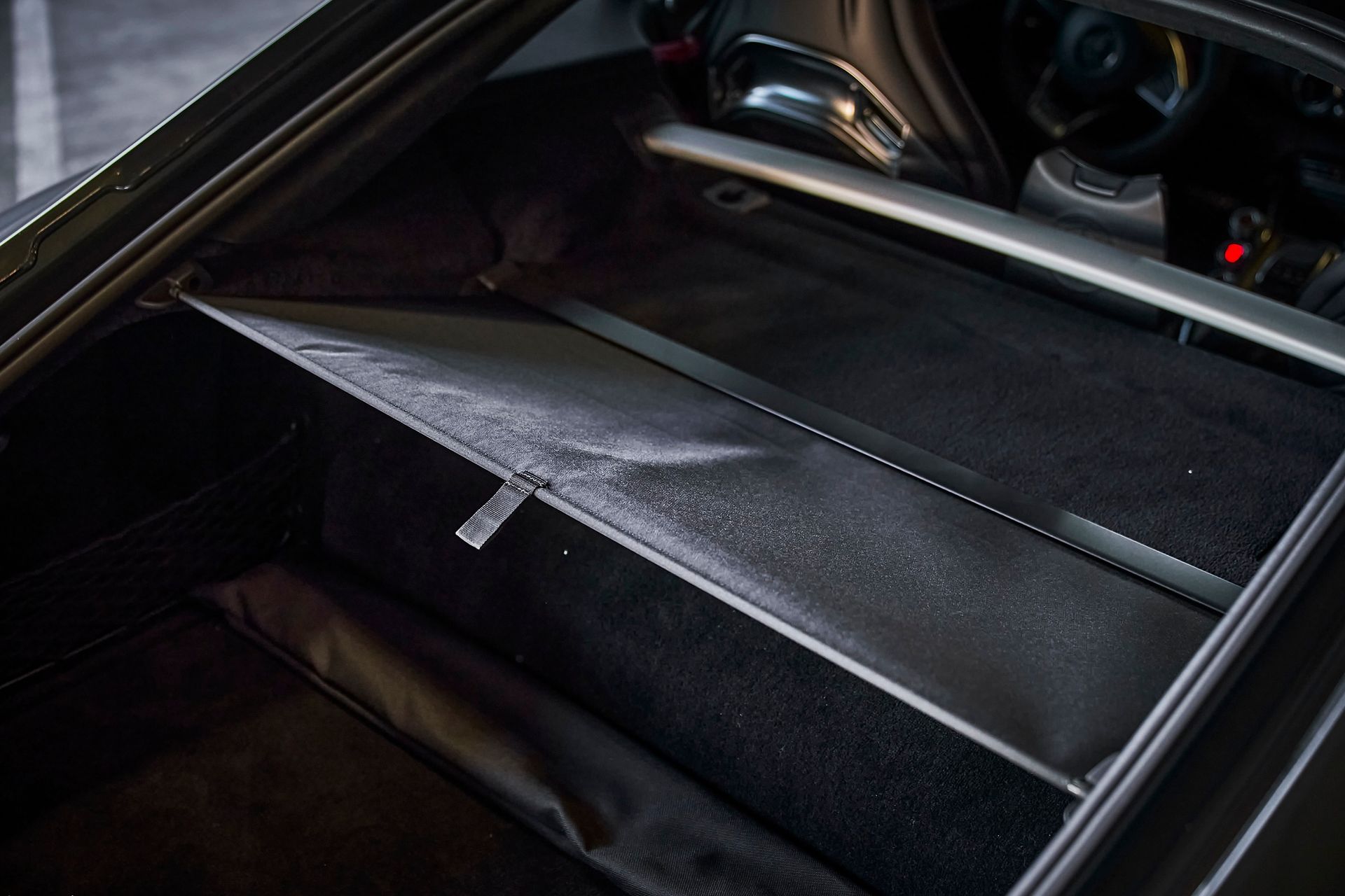 The trunk of a car with a bag in it