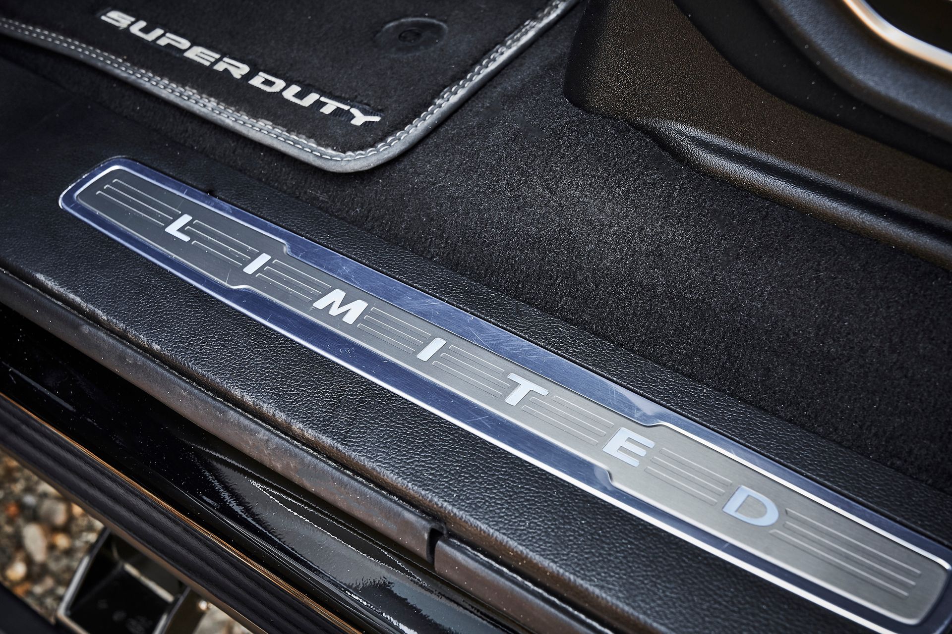 The word limited is on the side of a car