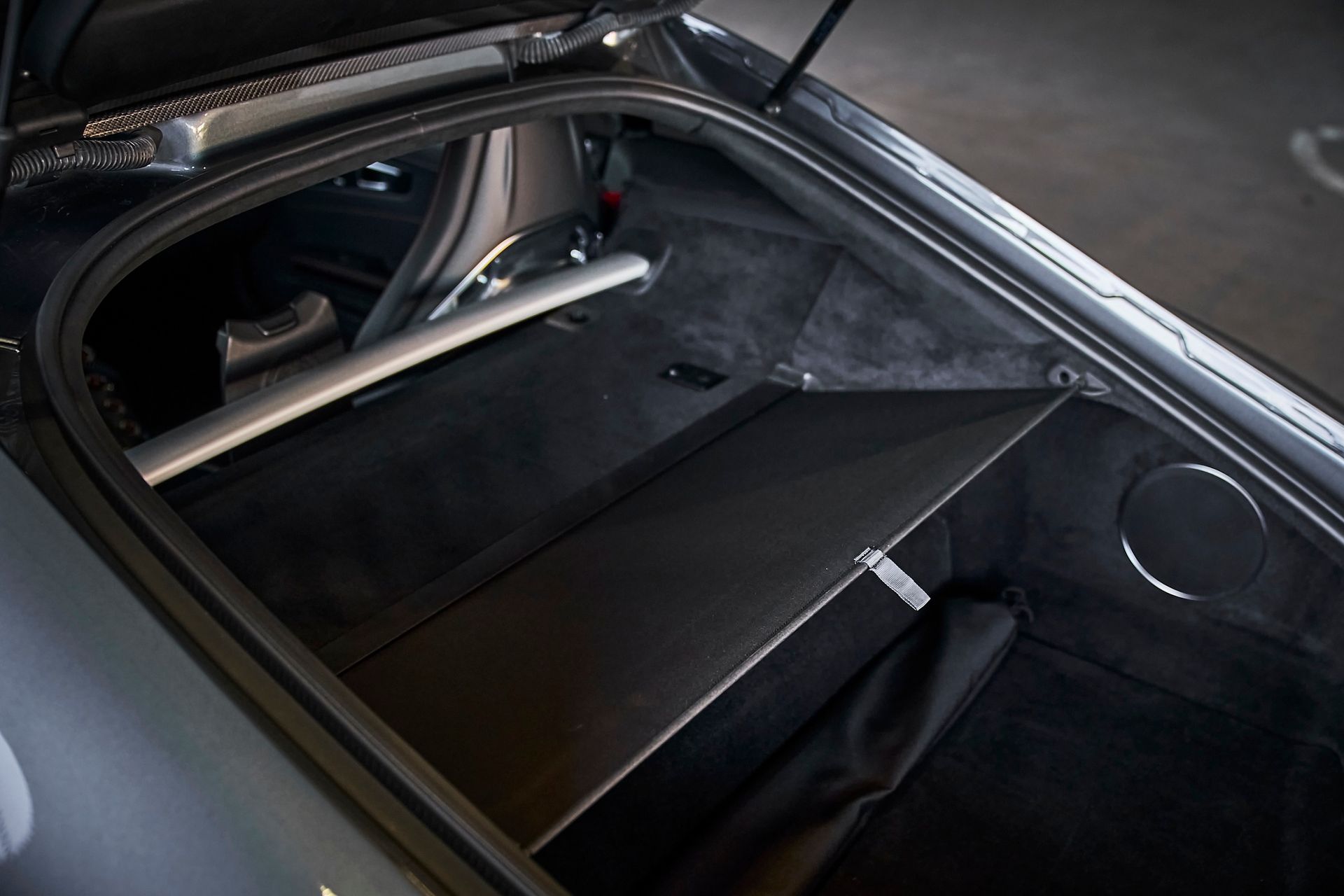 A close up of the trunk of a car with the trunk open