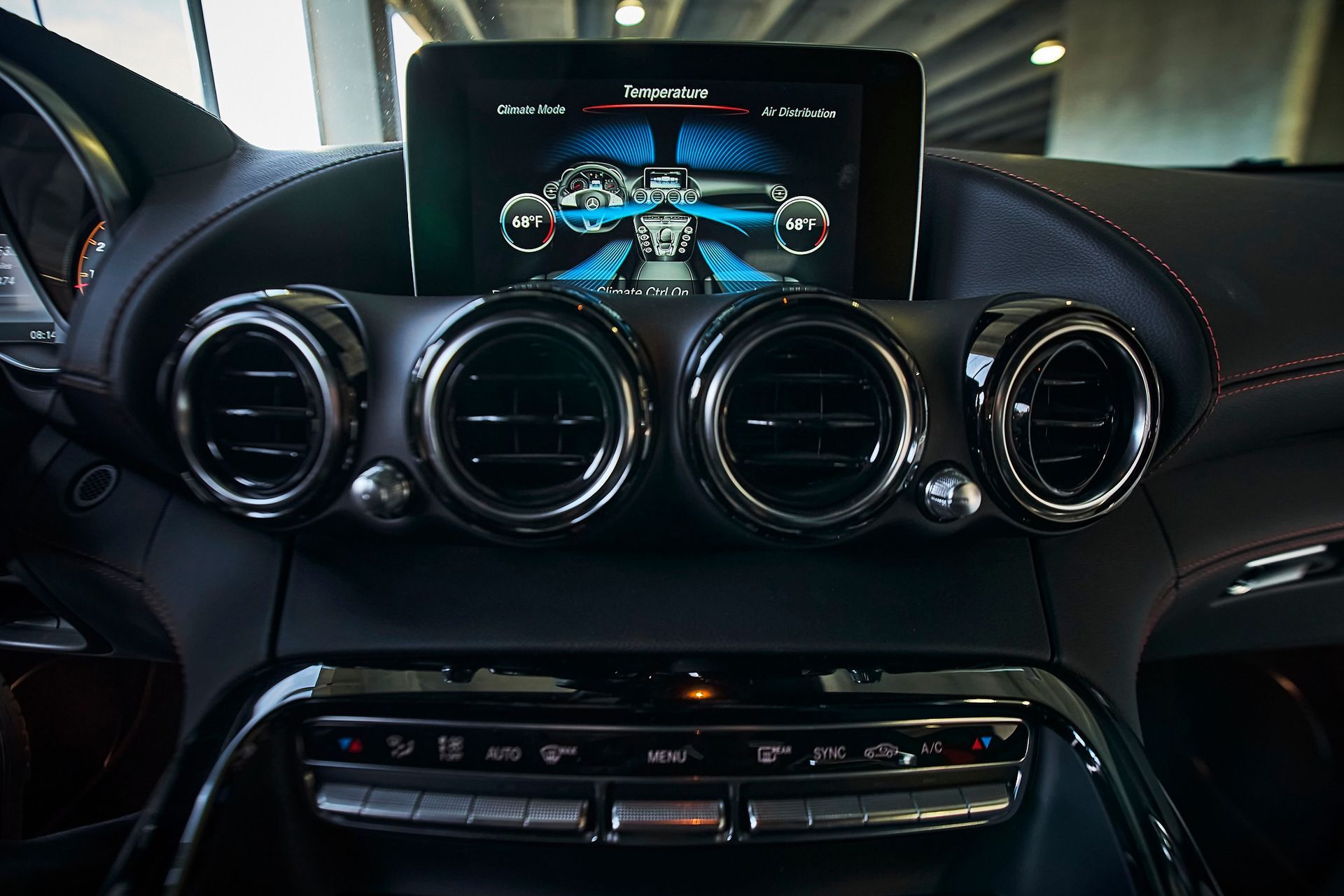 A close up of a car dashboard with a touchscreen display