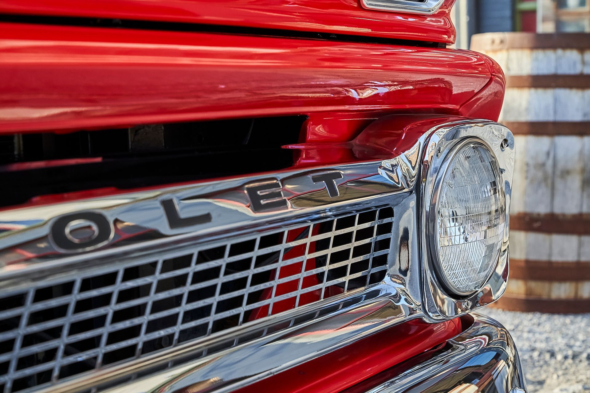 A close up of the front of a red truck.