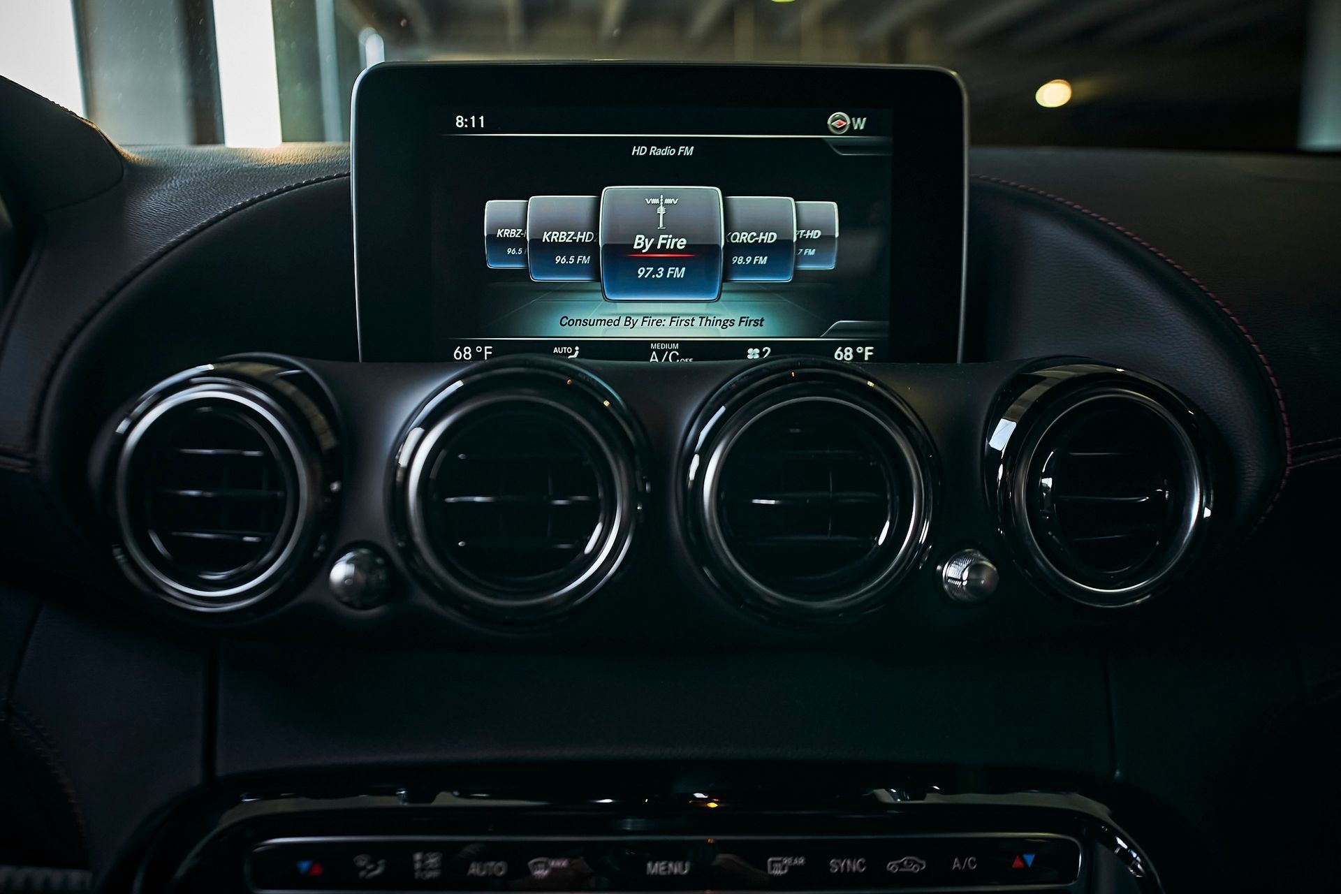 A car dashboard with a screen that says ' mercedes benz ' on it