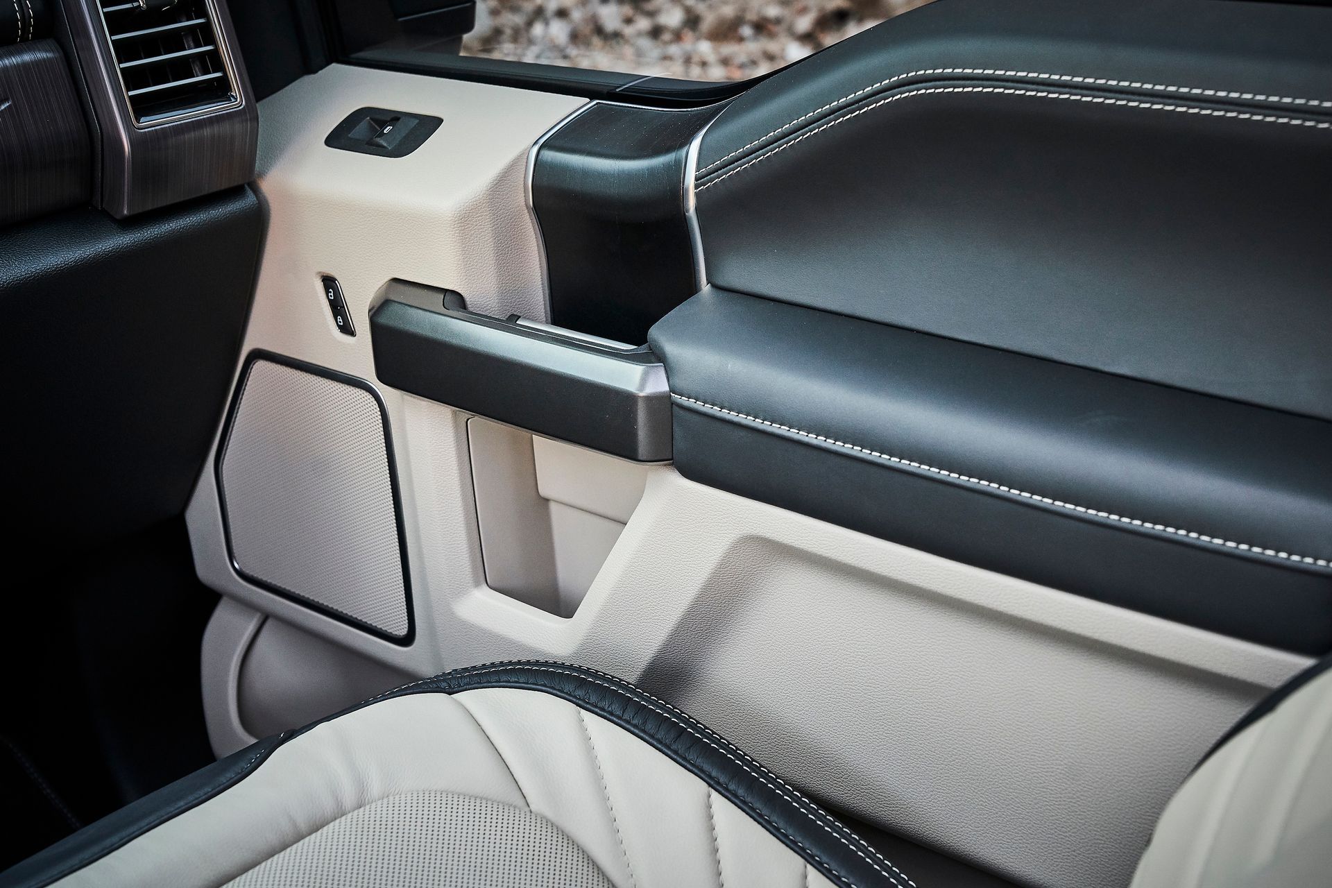A close up of a car console with a speaker