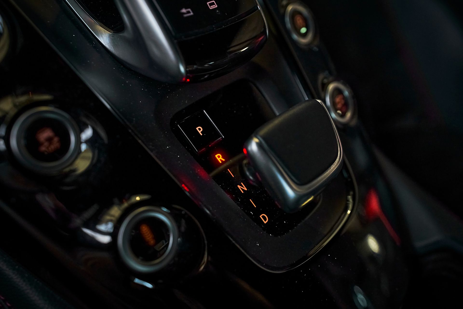 A close up of a shifter in a car.
