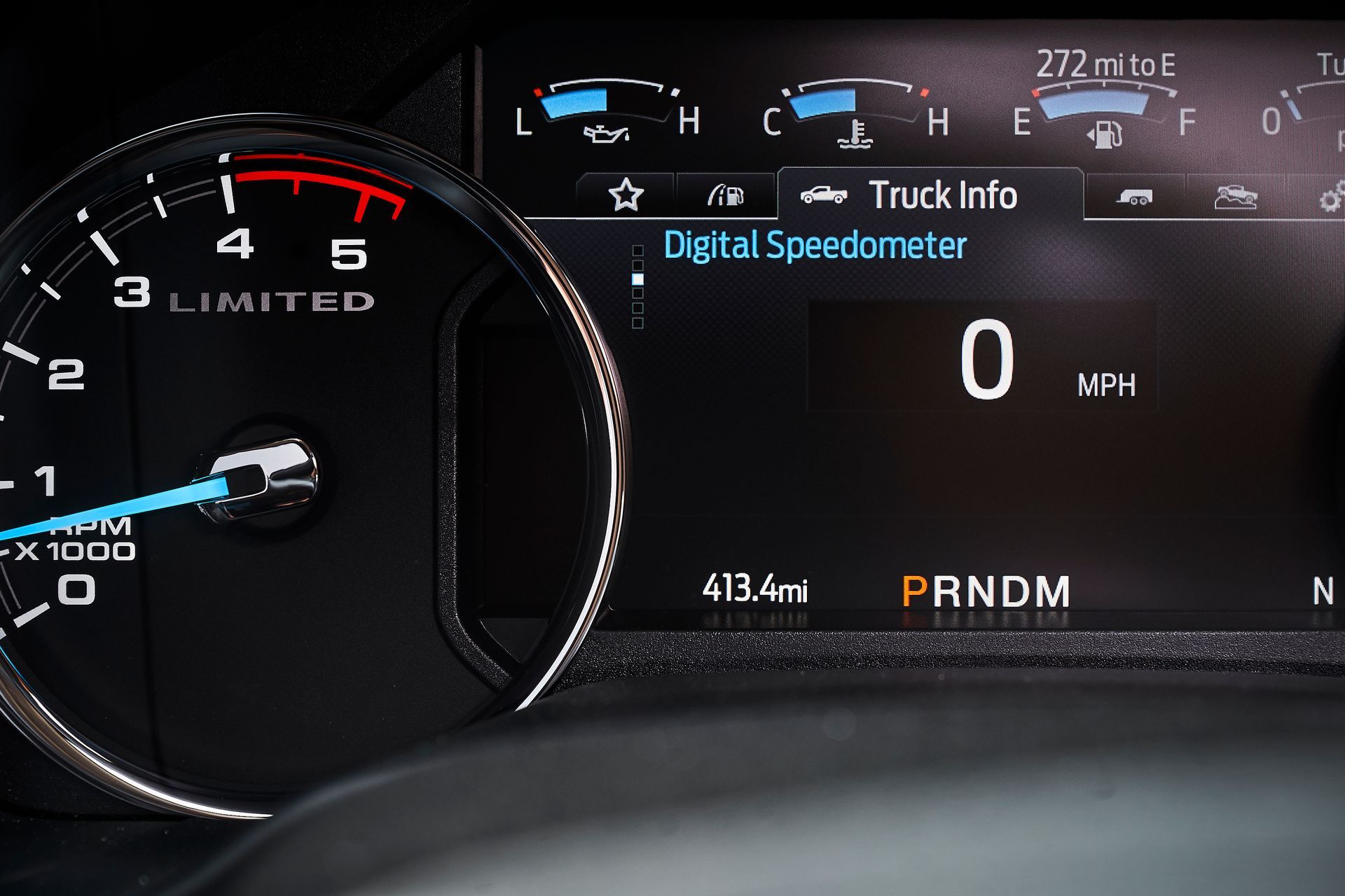 A close up of a digital speedometer in a car