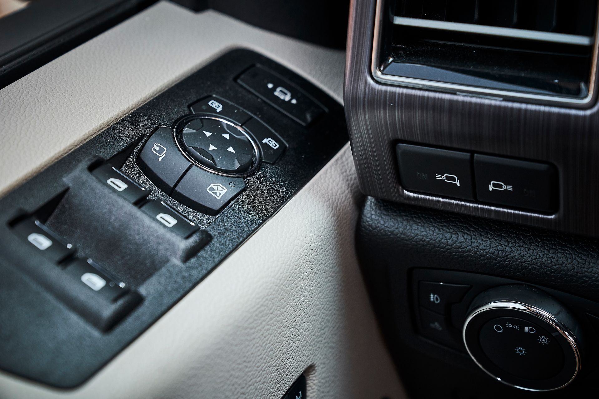 A close up of a car dashboard with a remote control