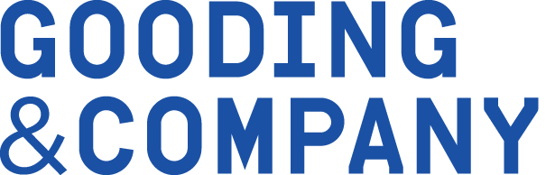 The logo for gooding & company is blue and white on a white background.