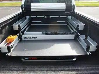 Fifth-wheel hitch mounted in a pickup truck bed, branded 