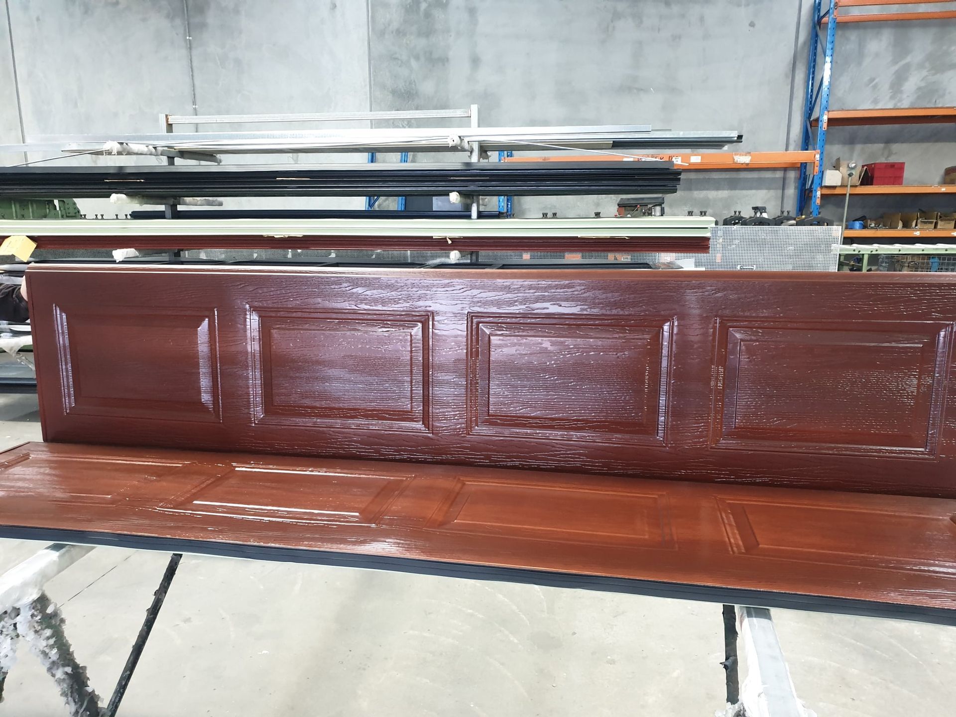 Factory Direct Garage Doors installer discussing a free estimate with a homeowner in Melbourne's eastern suburbs