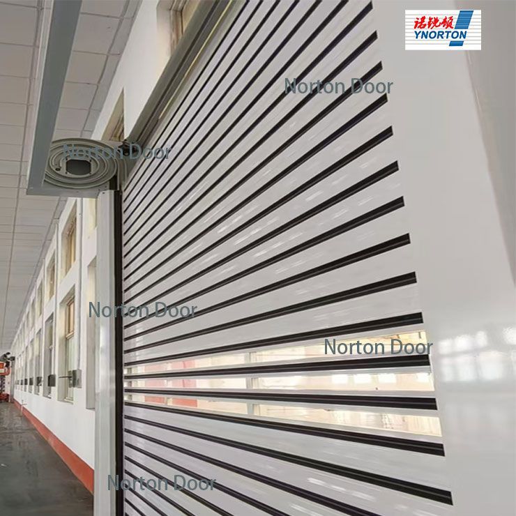 Exterior wall with white slatted panel and rows of windows on a building walkway