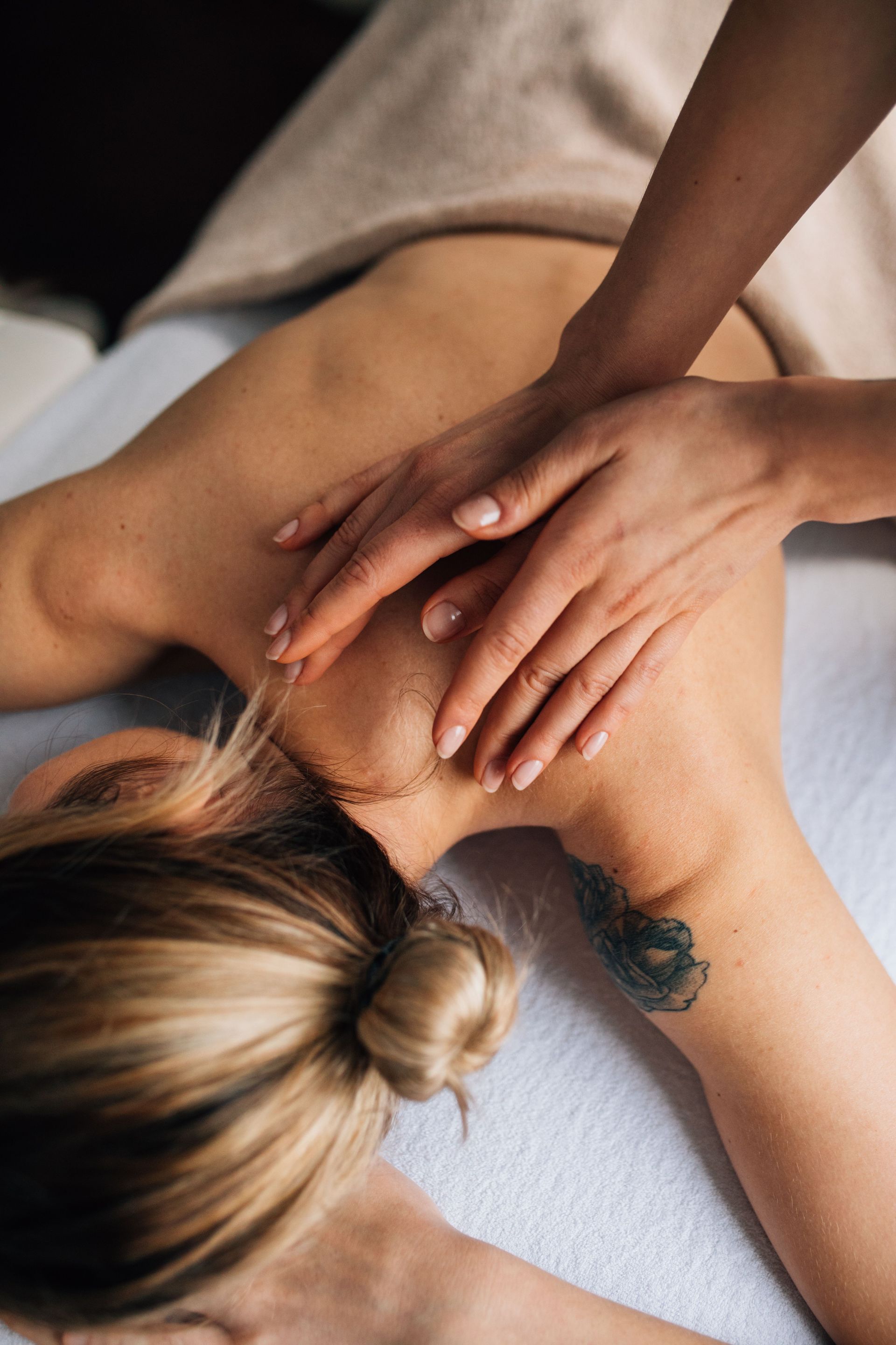 Therapist applying gentle techniques during lymphatic drainage massage