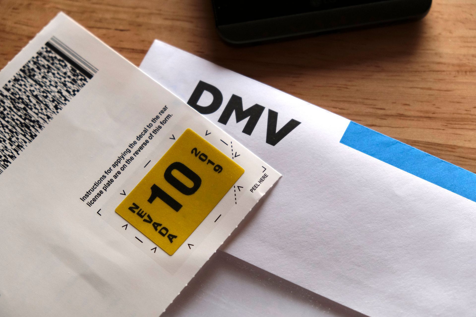 A piece of paper that says dmv on it. A piece of paper that says dmv on it.