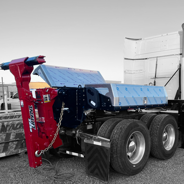 A truck with a tow truck attached to it