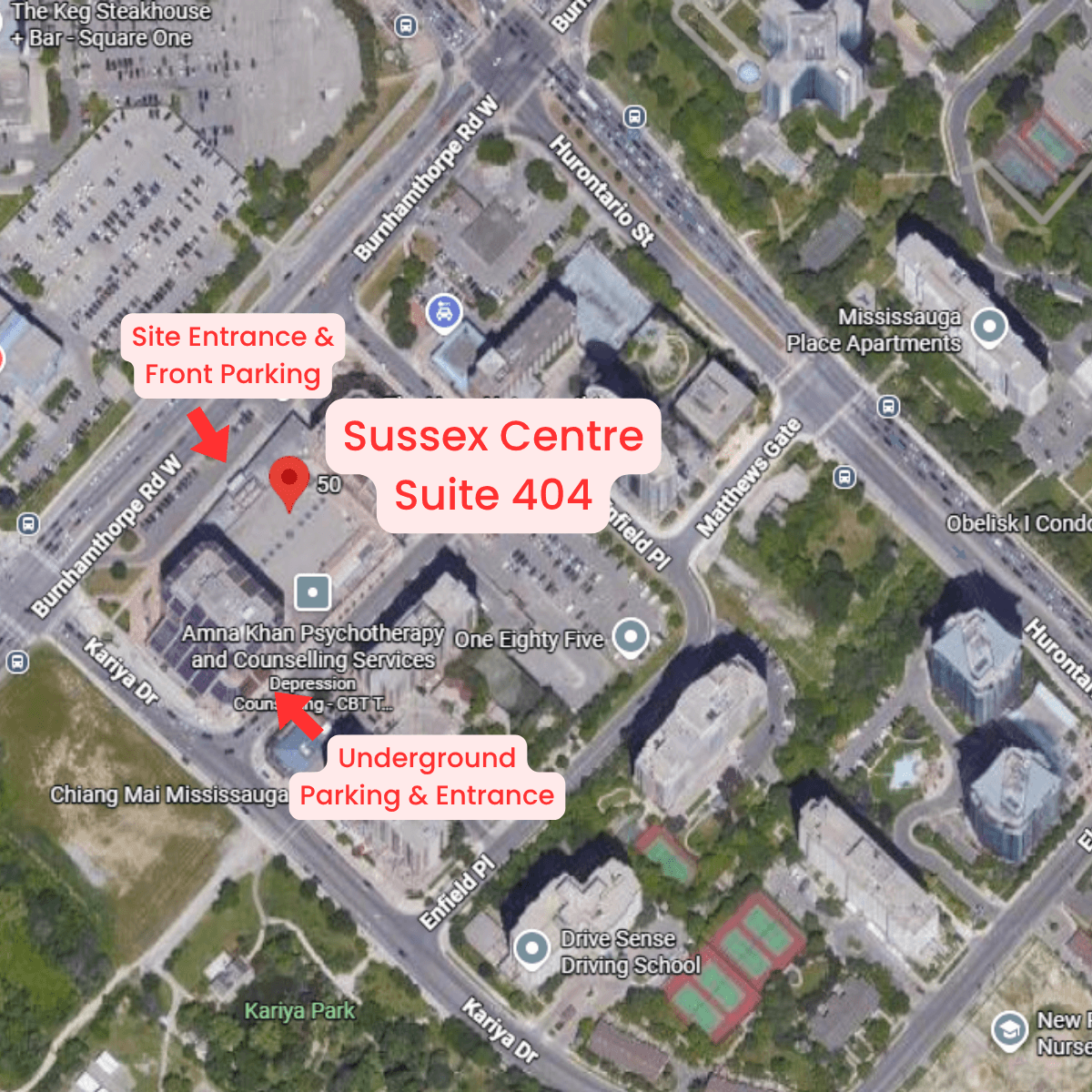 An aerial view of a hospital with a red arrow pointing to it