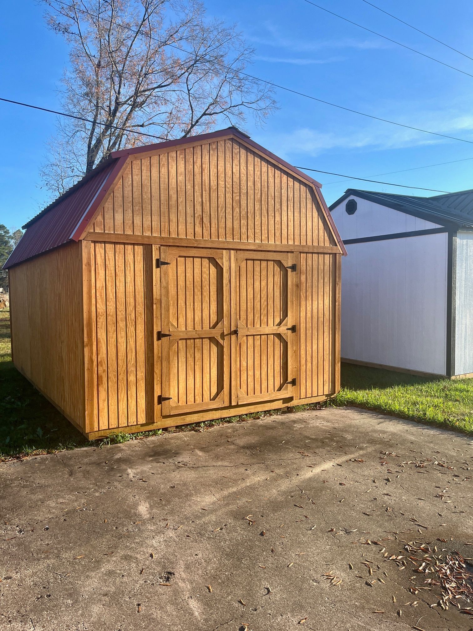 A picture of a wooden house with a porch