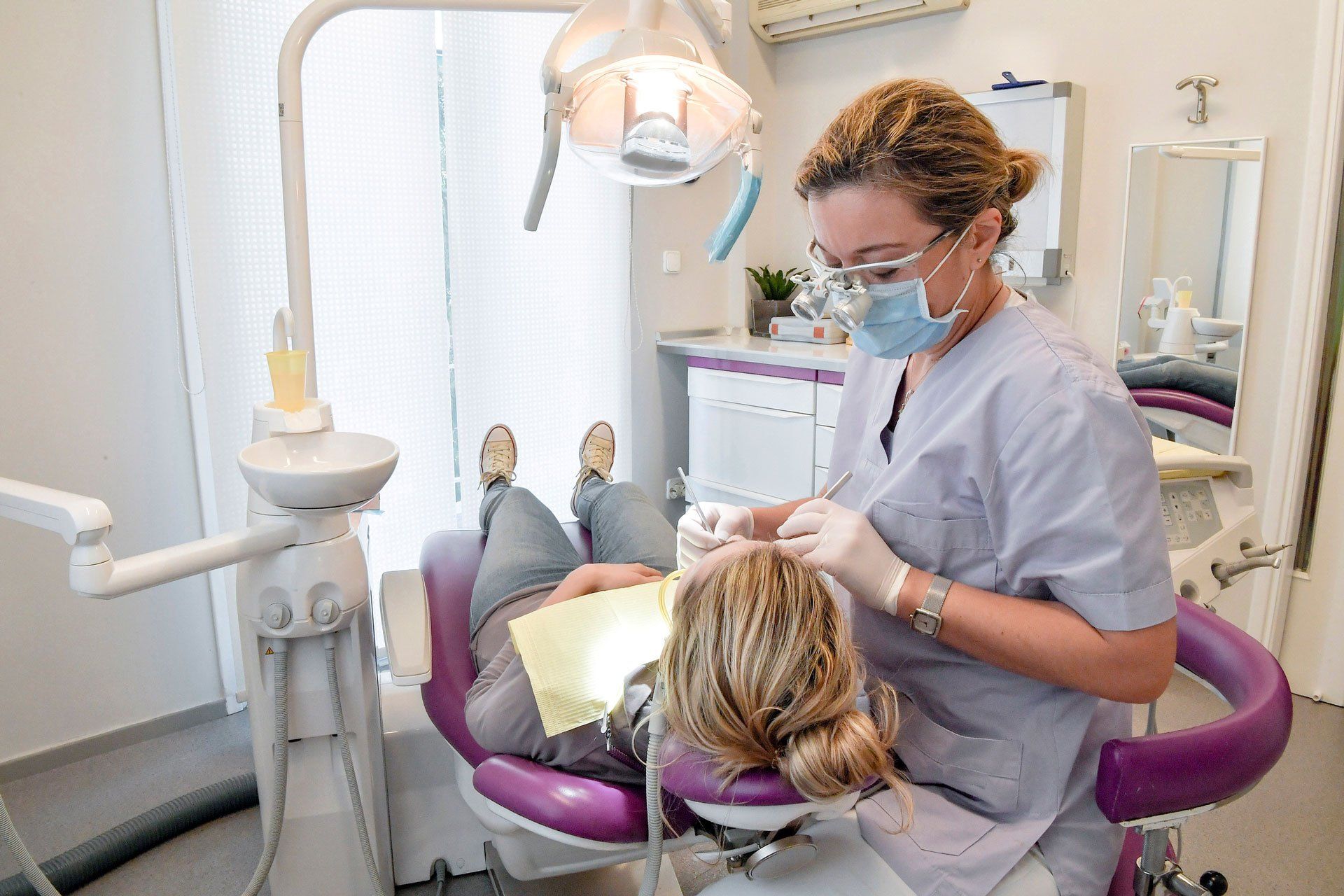 A dentist doing some operation on the patient – Blacktown, NSW – Smiles for All