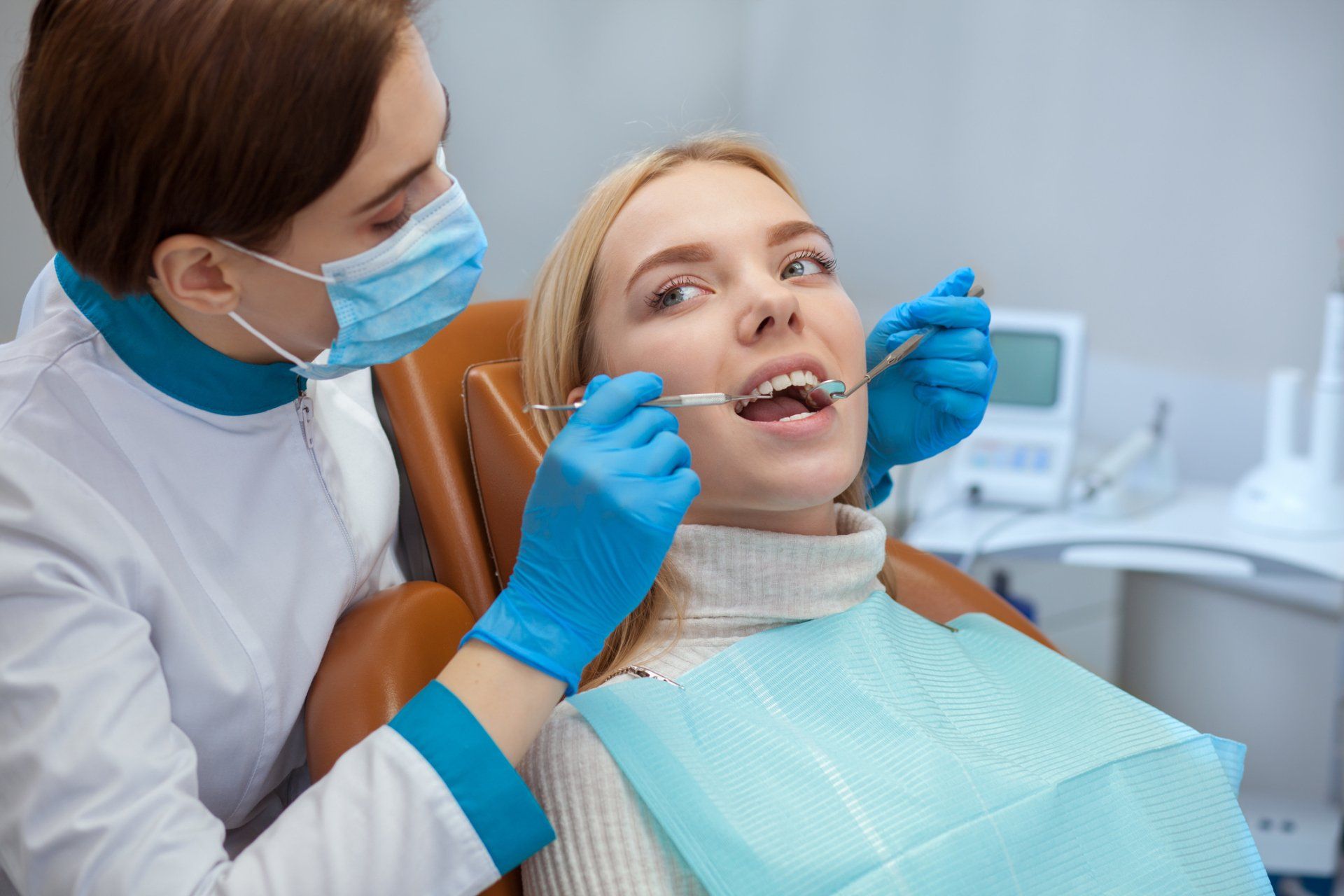 A girl dentist checking girl patient's teeth – Blacktown, NSW – Smiles for All