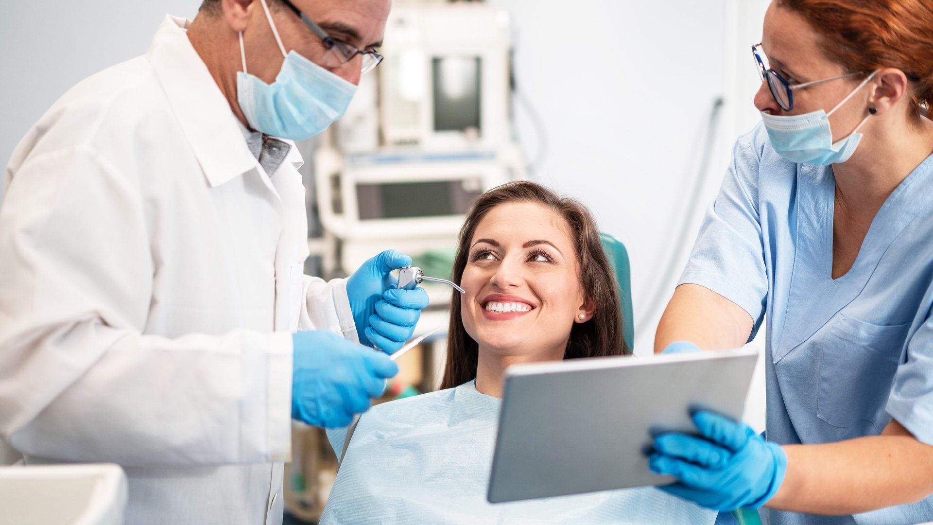 A dentist is showing a tablet to the patient – Blacktown, NSW – Smiles for All