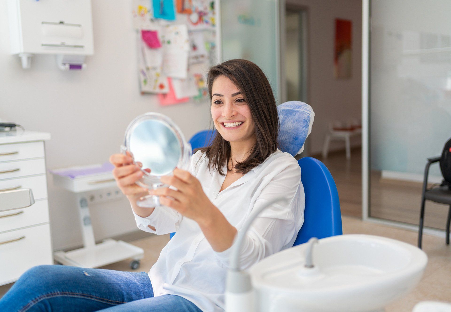 A girl smiling in front of the mirror – Blacktown, NSW – Smiles for All