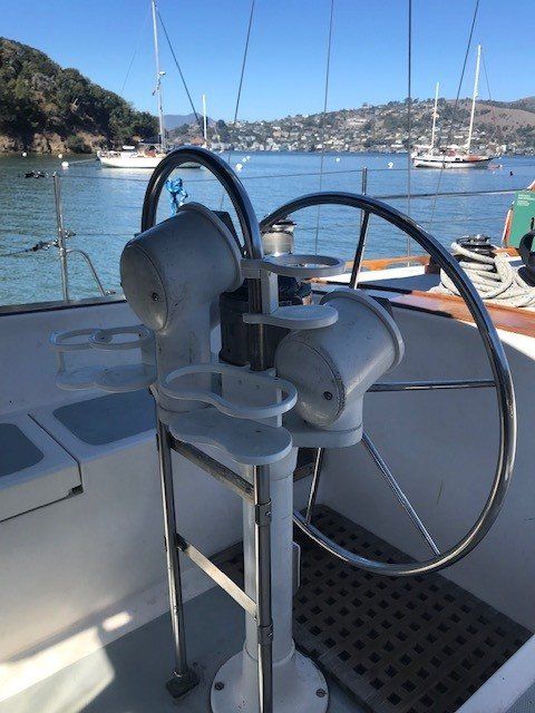 Osprey sailing by anchored boats near Angel Island.