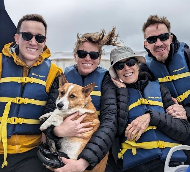 A group enjoying a windy say with their dog!