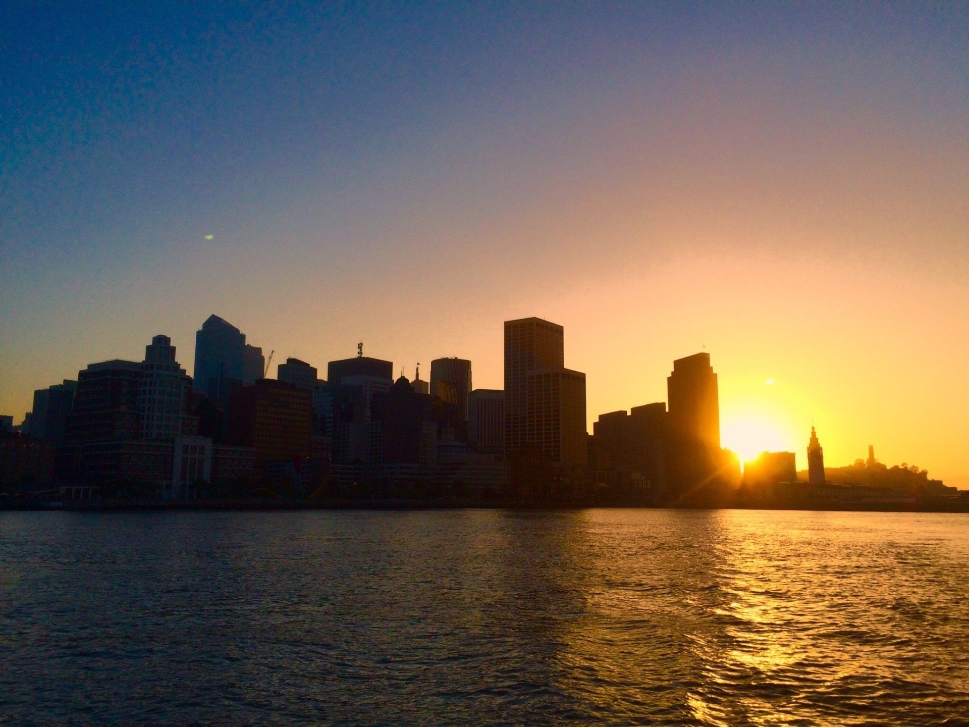 the sun setting behind San Francisco.
