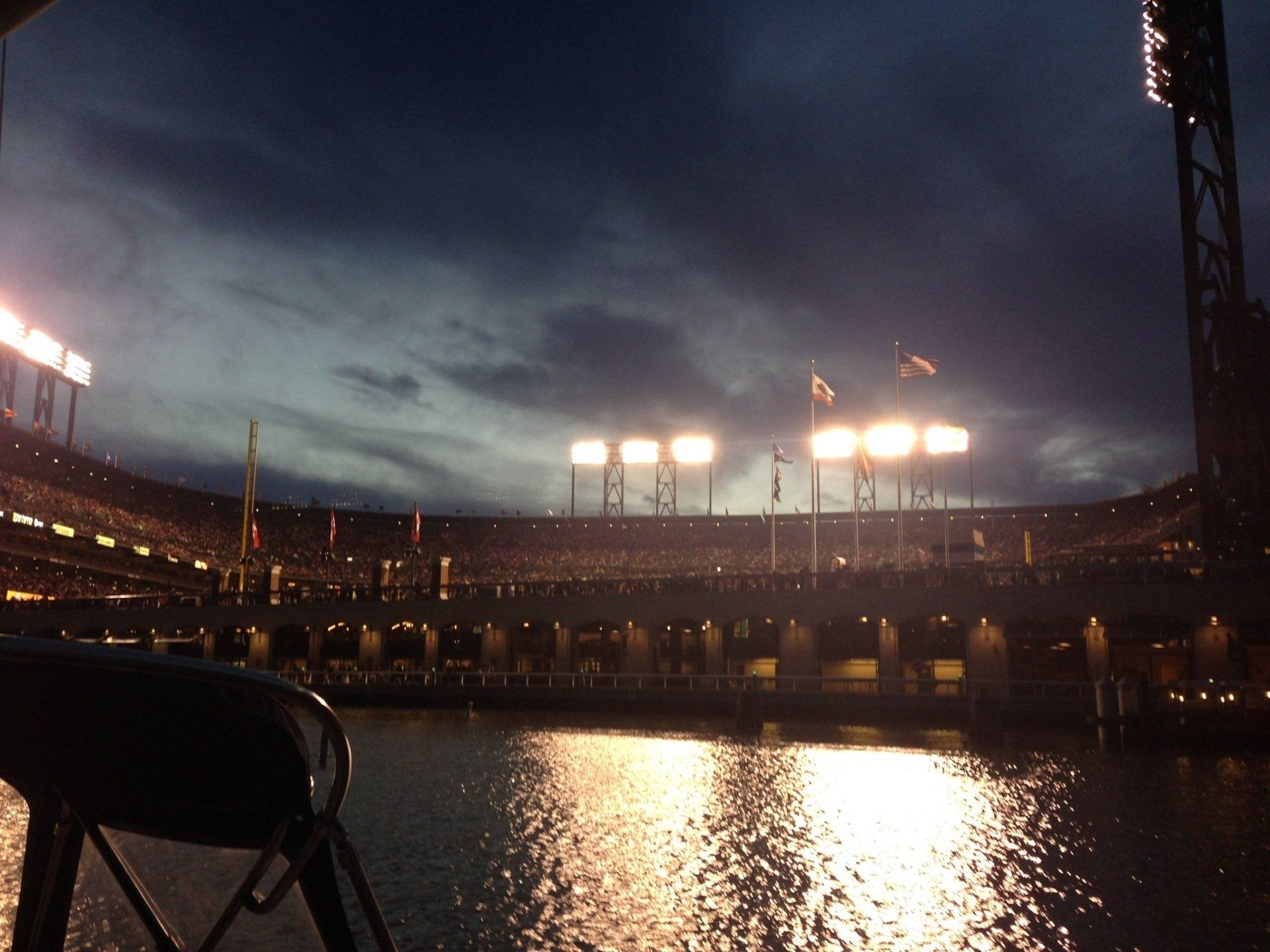 Watching a baseball game from the water with Oracle Park lit up.
