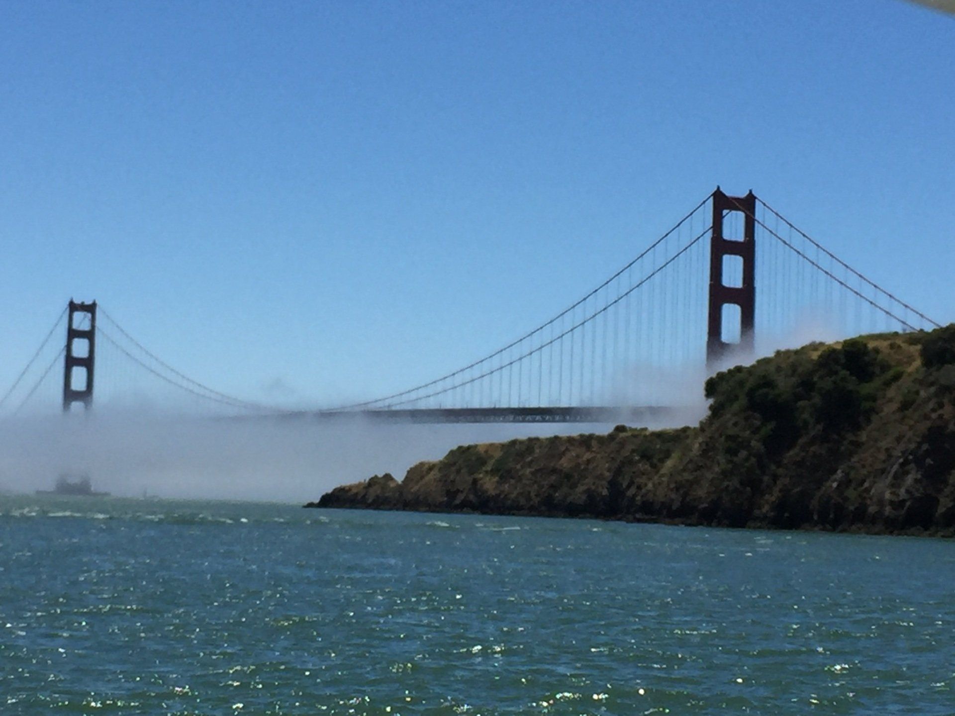 Fog rolling into the bay under the Golden Gate Bridge. 