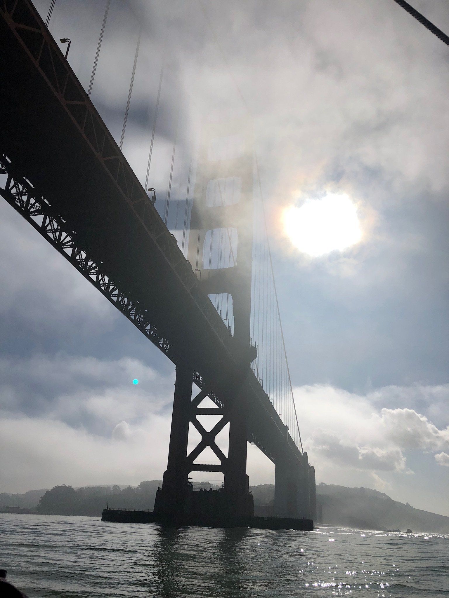 A foggy yet sunny day over the Golden Gate Bridge.