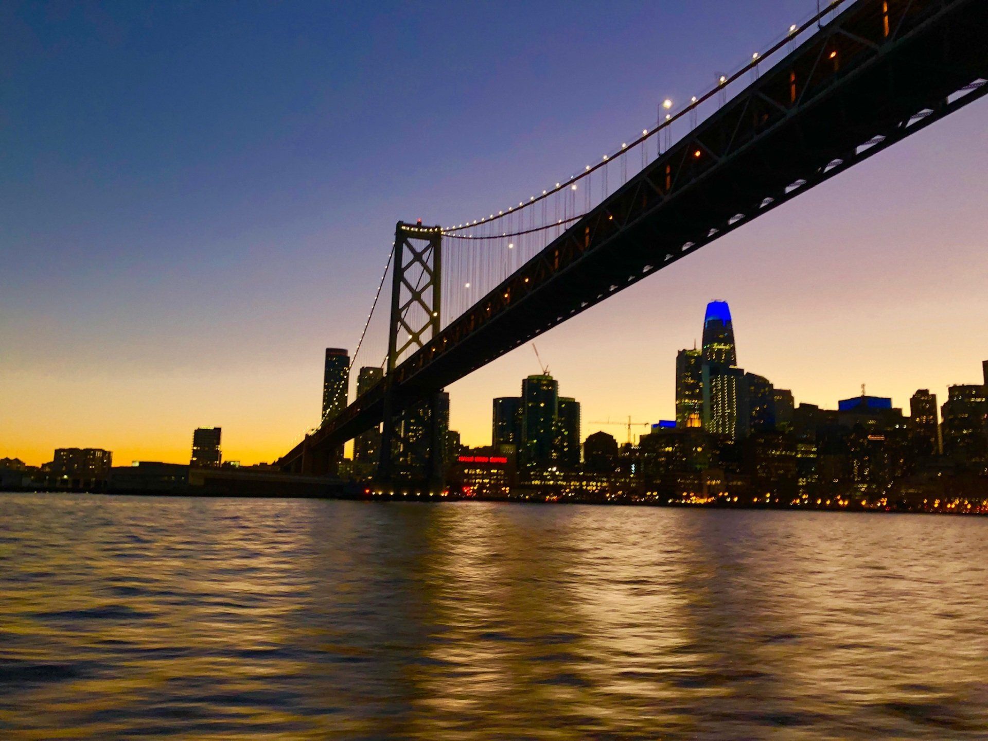 The Bay Bridge lit up at night.