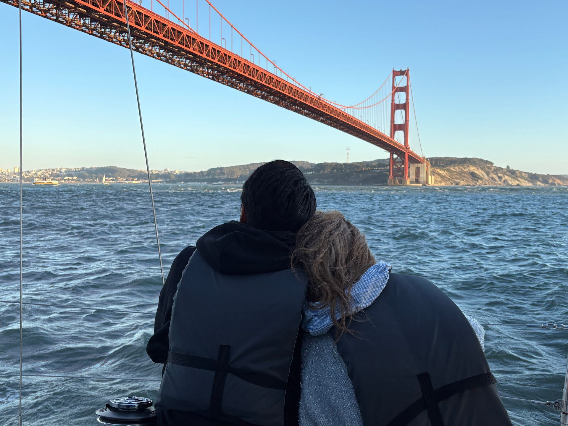 Couple enjoying the Golden Gate Bridge on a fall day.