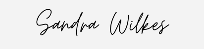 Sandra Wilkes in elegant cursive font.