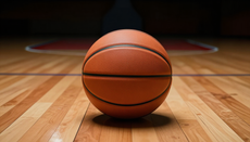 Basketball on a court with cinematic lighting.