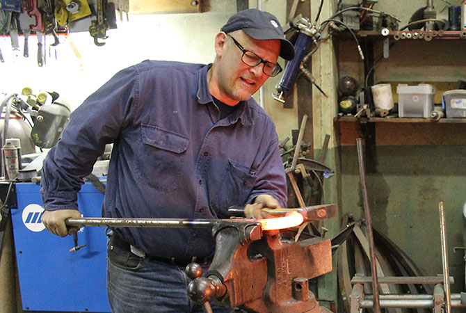 Mark Herman at the forge