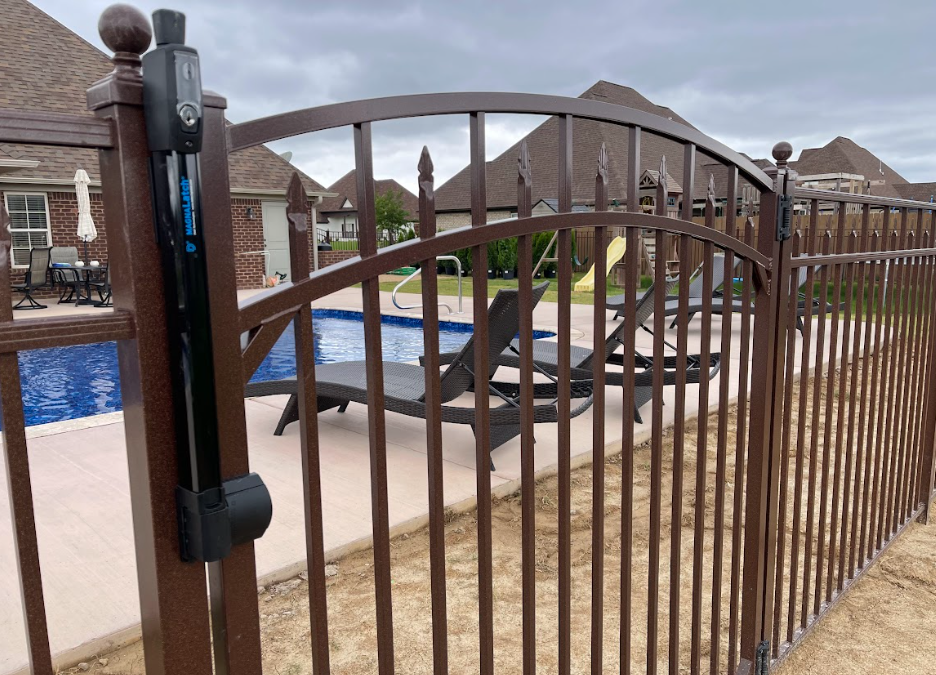 Closed metal gate in front of a swimming pool in an apartment courtyard